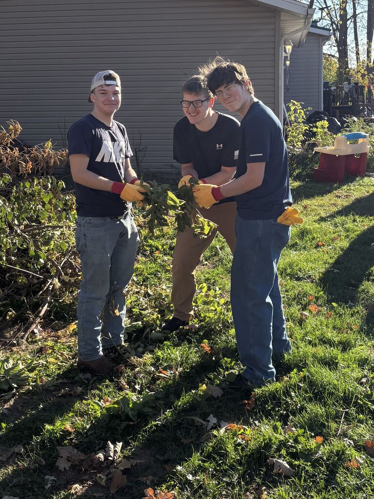 HS Students help with village brush piles.