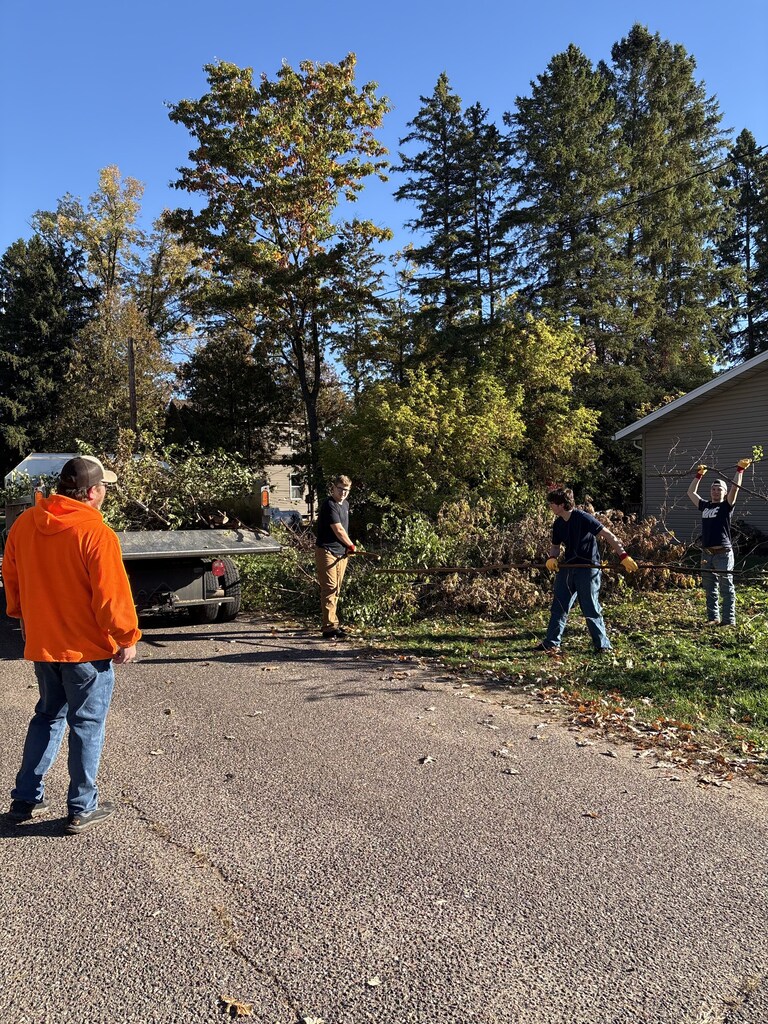 HS Students help with village brush piles.