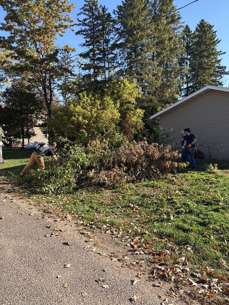 HS Students help with village brush piles.