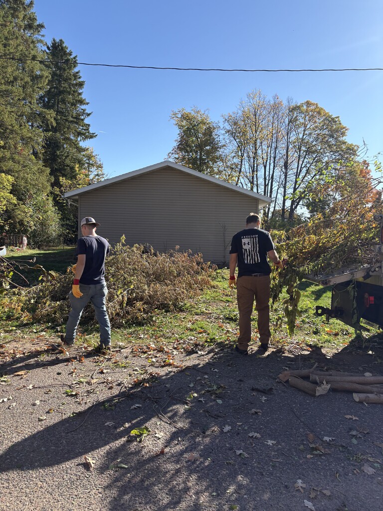 HS Students help with village brush piles.