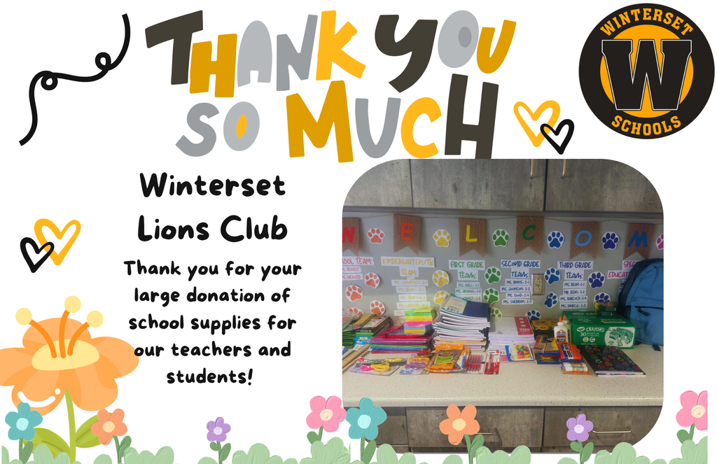 A sign thanks Winterset Lions Club for a donation. Displayed are school supplies, a desk, and flowers.