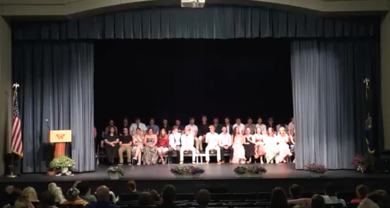 Image of class seated on stage