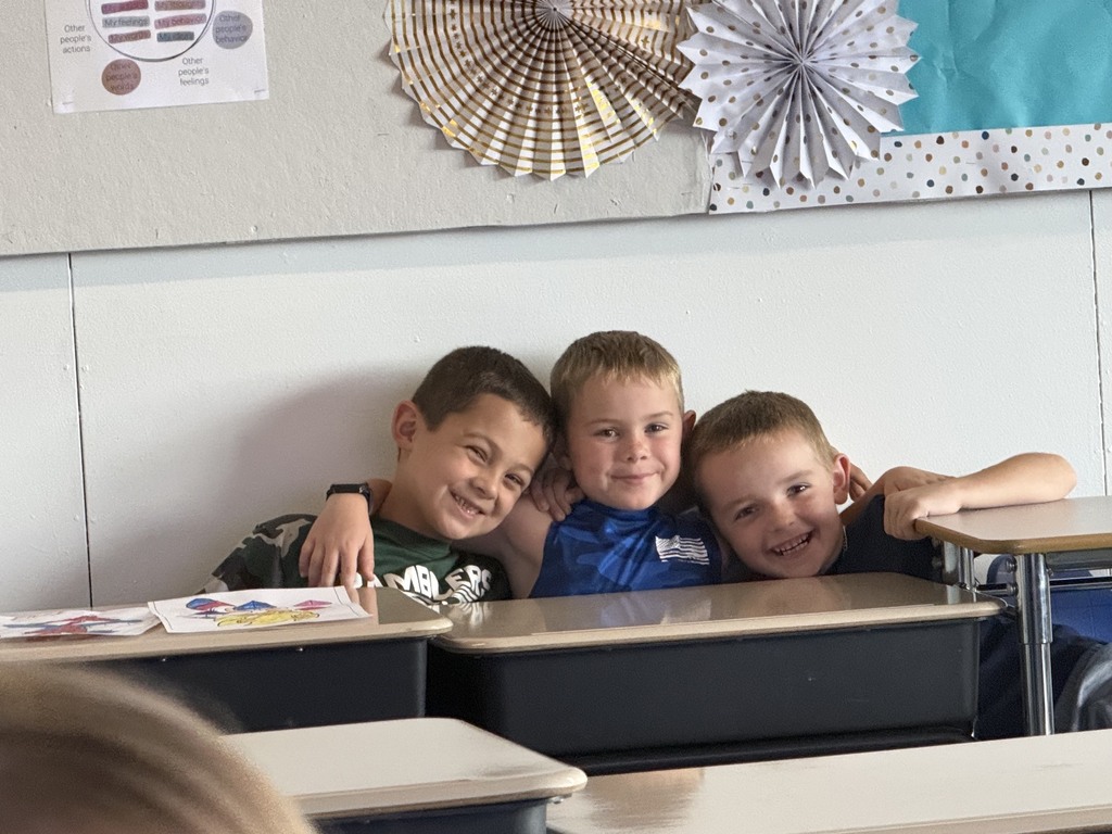 Picture of students hugging. 