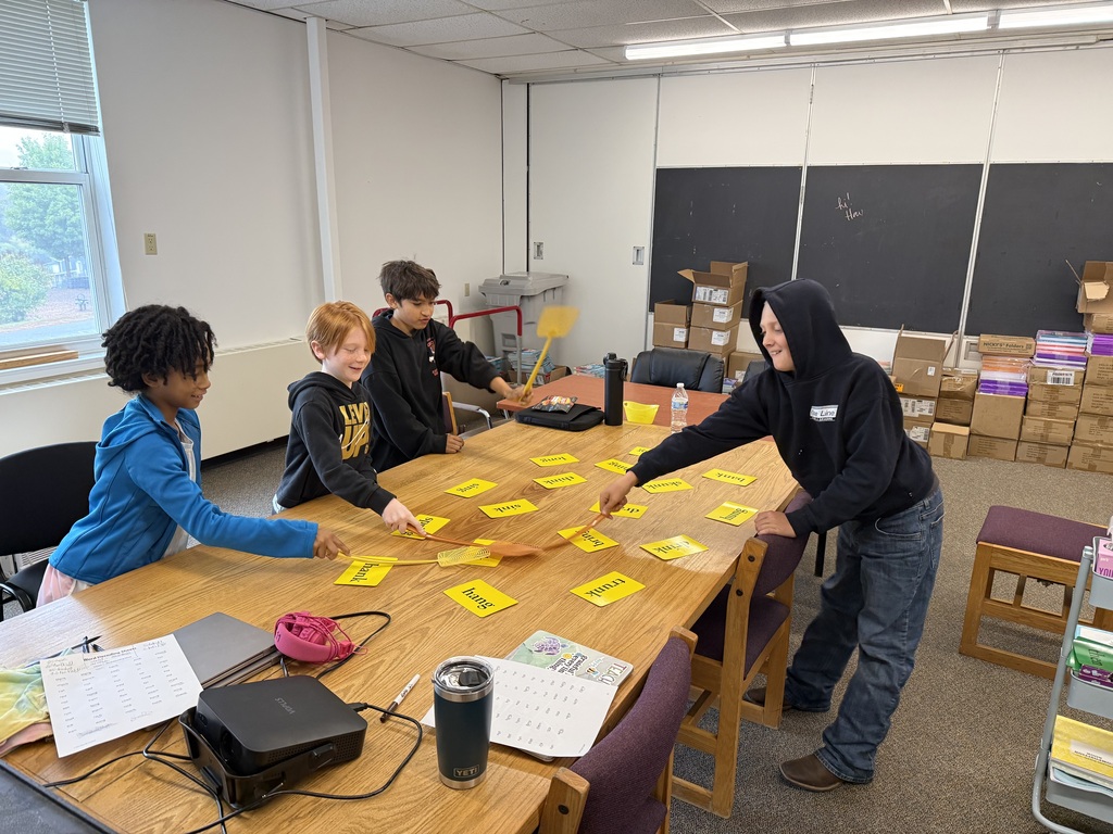 students swatting words on yellow cards