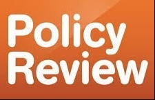Policy Review in orange with white letters