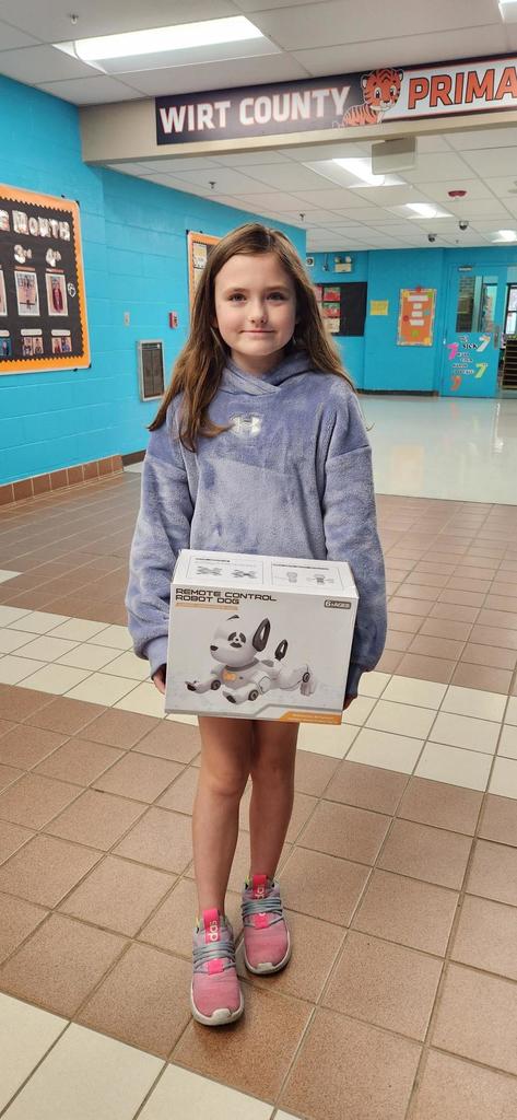 Photo of Peyton Wolek with digital dog prize