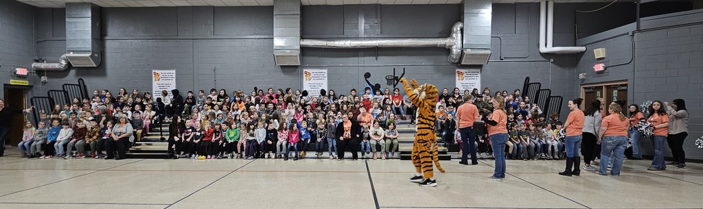 Photo of students on new bleachers in the gym