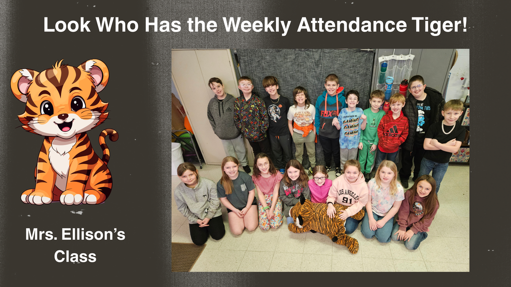 A classroom photo of Mrs. Ellison’s students smiling together. They are gathered around in their classroom, posing proudly after receiving the Attendance Tiger for their excellent attendance.