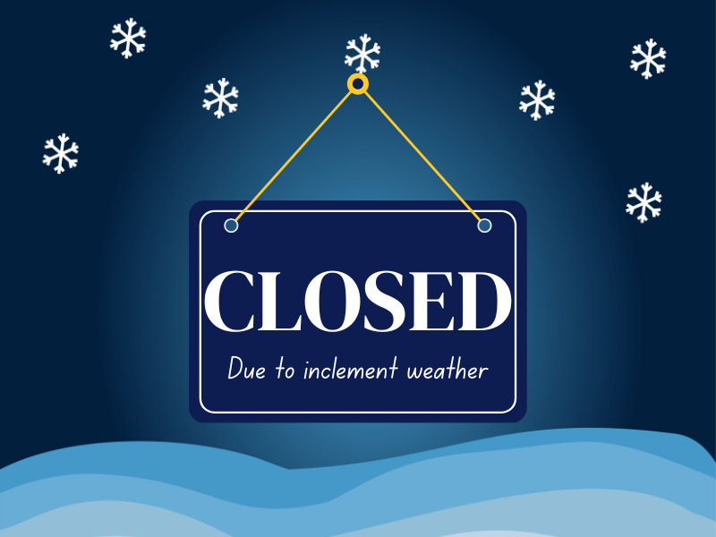 sign Closed due to inclement weather with blue background and white snowflakes
