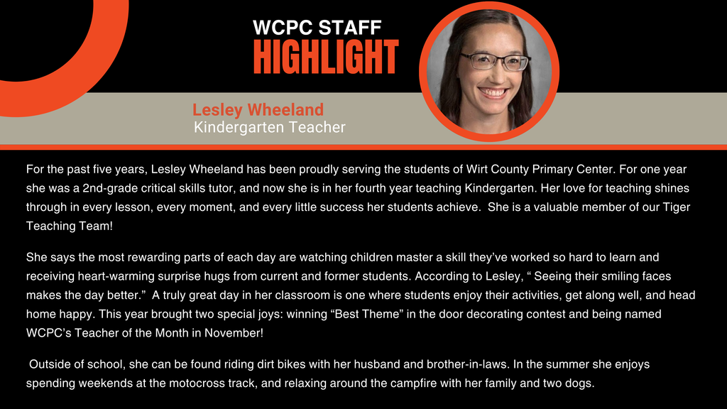 A graphic titled “WCPC Staff Highlight” with a black background and orange accents. Beneath the title, there is a circular photo frame containing an image of a person. Below the photo, text displays the name “Lesley Wheeland” and the title “Kindergarten Teacher” in orange and white. The graphic includes several paragraphs describing Lesley’s five years at Wirt County Primary Center, her rewarding moments in the classroom, accomplishments such as winning “Best Theme” in the door decorating contest and being named November Teacher of the Month, and her hobbies, including riding dirt bikes, spending time at the motocross track, and enjoying campfires with family and two dogs.