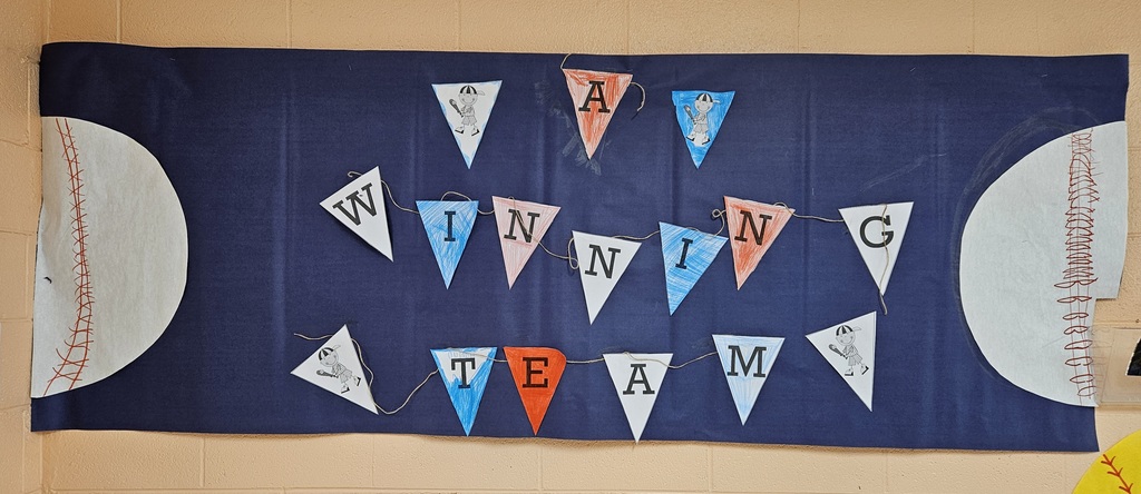 Hallway bulletin boards and classroom doors decorated with a baseball theme, featuring colorful signs, student names, and encouraging test‑taking messages such as “Cover Your Bases,” “Swing for the Fences,” and “Knock It Out of the Park” to motivate students for upcoming assessments.