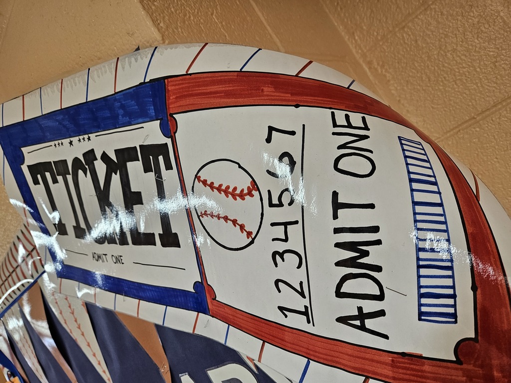 Hallway bulletin boards and classroom doors decorated with a baseball theme, featuring colorful signs, student names, and encouraging test‑taking messages such as “Cover Your Bases,” “Swing for the Fences,” and “Knock It Out of the Park” to motivate students for upcoming assessments.