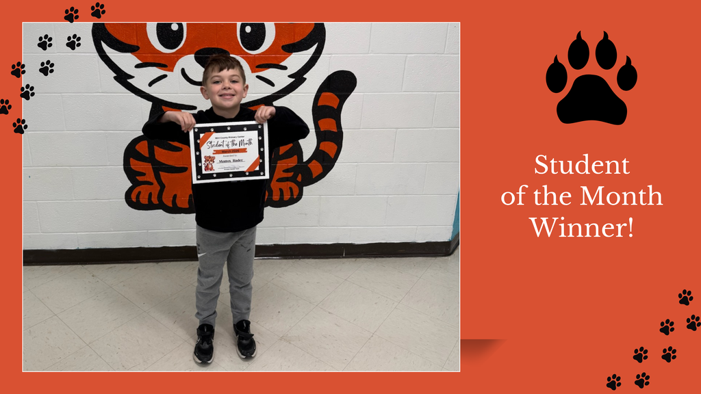 A student stands in a school hallway in front of a painted tiger mural, holding a “Student of the Month” certificate. The certificate recognizes the student as a March Student of the Month. Decorative text on the image reads “Student of the Month Winner!”