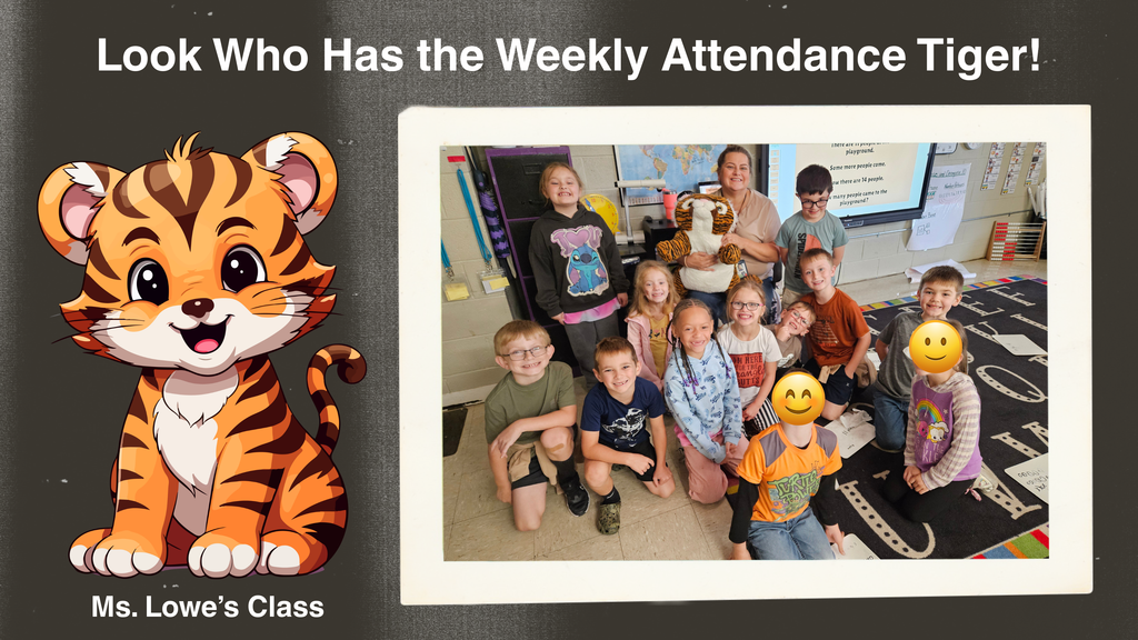 A classroom scene showing a group of elementary students seated and standing together indoors. A plush tiger mascot representing the Weekly Attendance Tiger is held at the center of the group. On the left side of the image is a cartoon illustration of a smiling tiger. Text at the top reads, “Look Who Has the Weekly Attendance Tiger!” and text at the bottom reads, “Ms. Lowe’s Class.”
