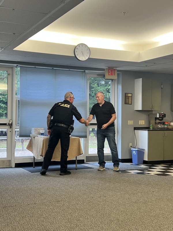 Chief congratulating Perry