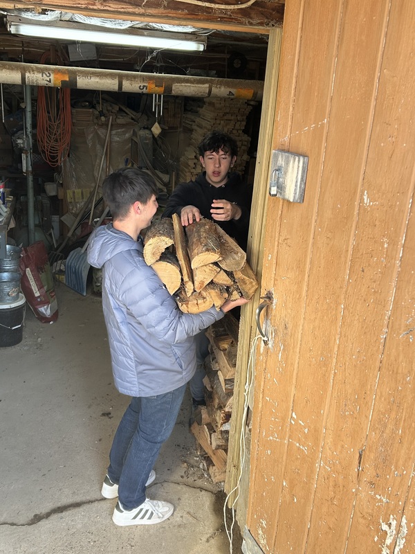 boys stacking wood