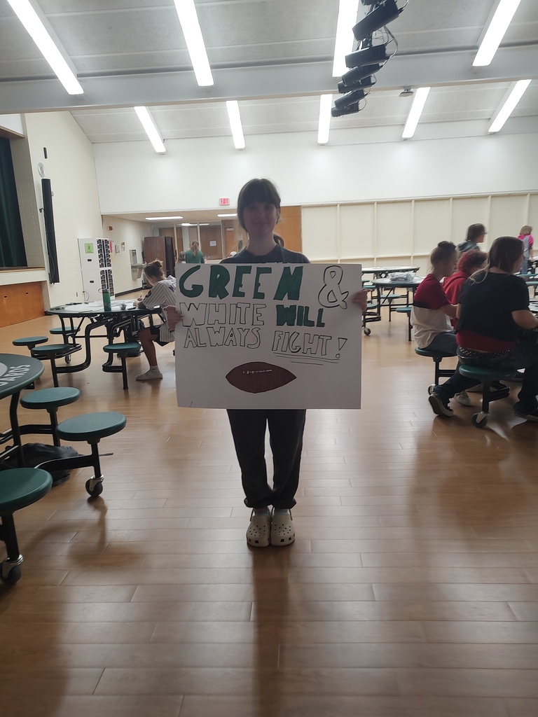 student holding sign for parade