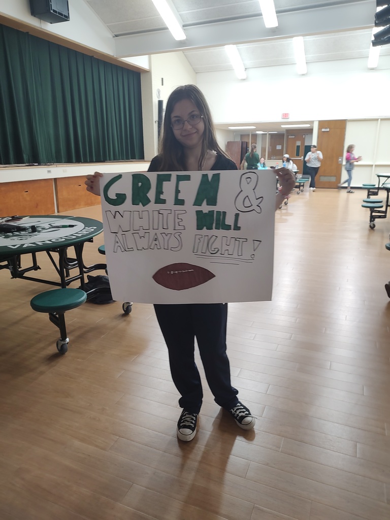 student holding sign for parade