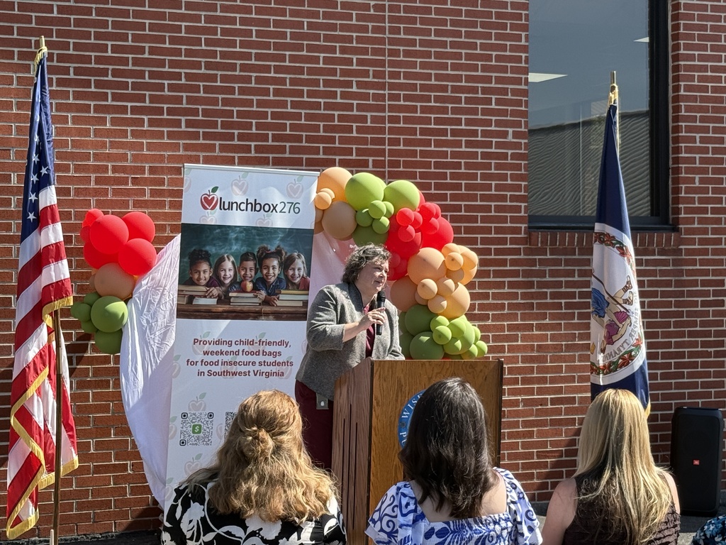 Maggie Beal, Director of DHCD speaks at Lunchbox276 ribbon-cutting