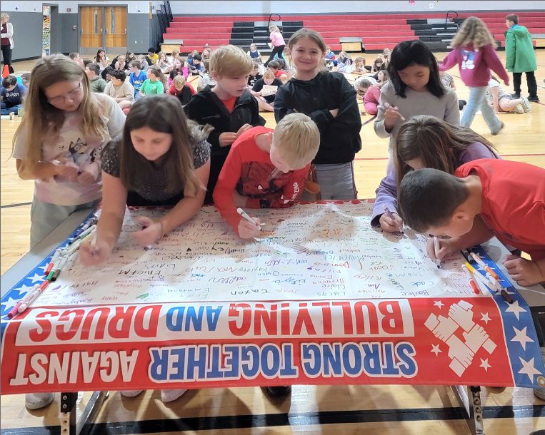 Students sign a pledge against bullying