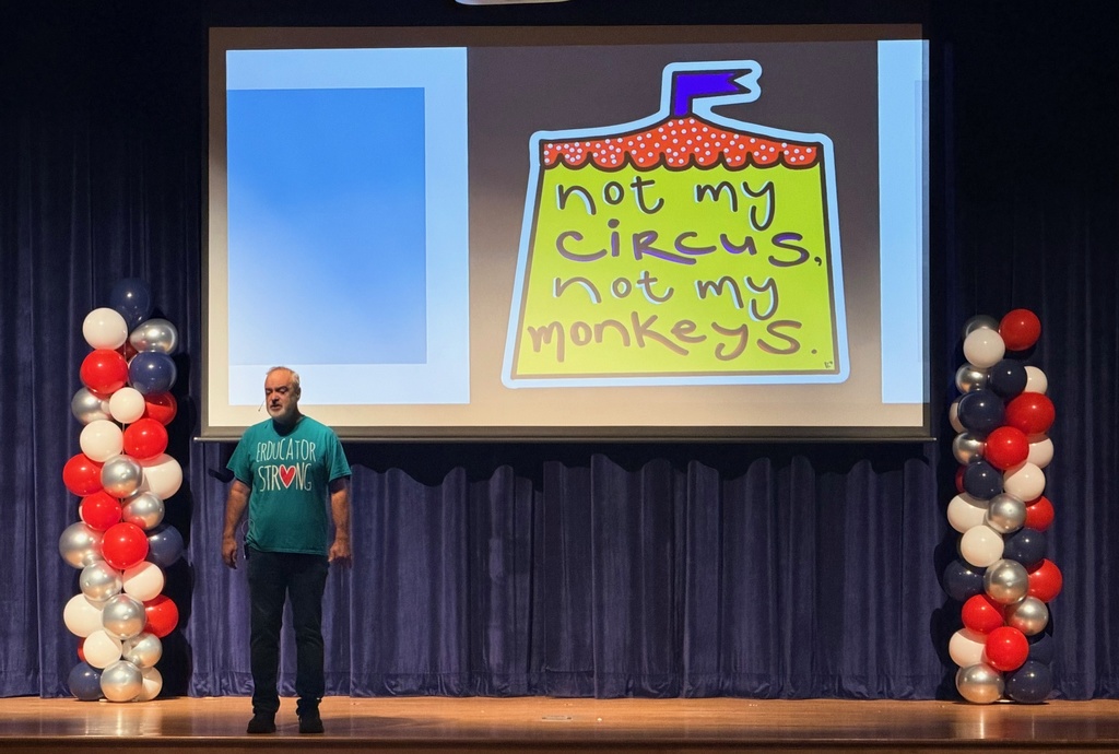 Mr. Brooks speaks to audience of teachers, staff and adminstration