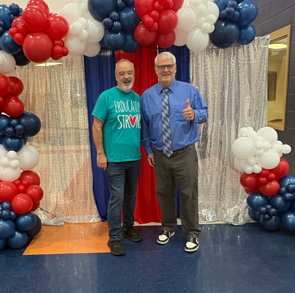 Mr. Brooks stands with Mr. Clendenon