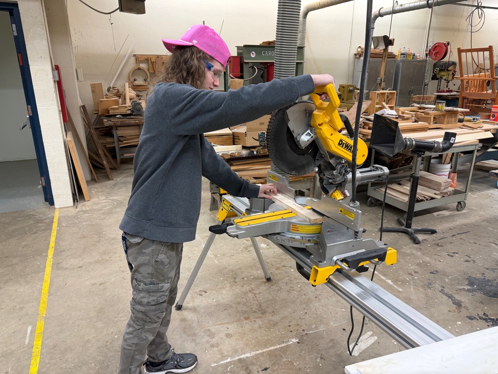 Students work on a saw