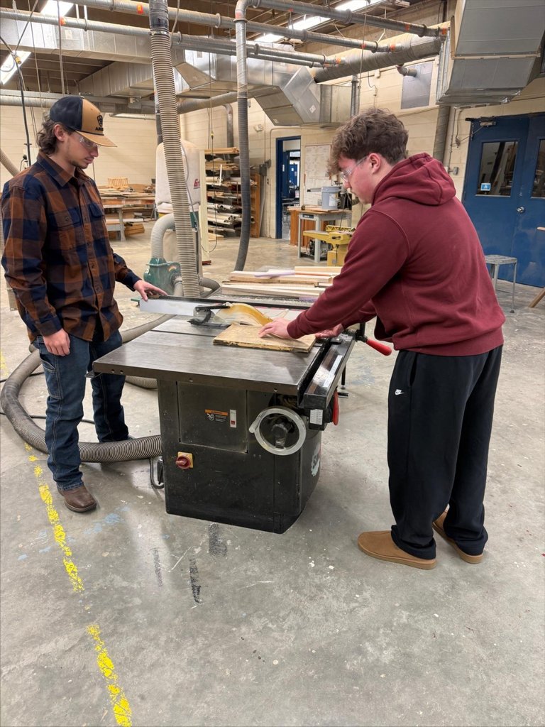 Building trades students work on a construction project