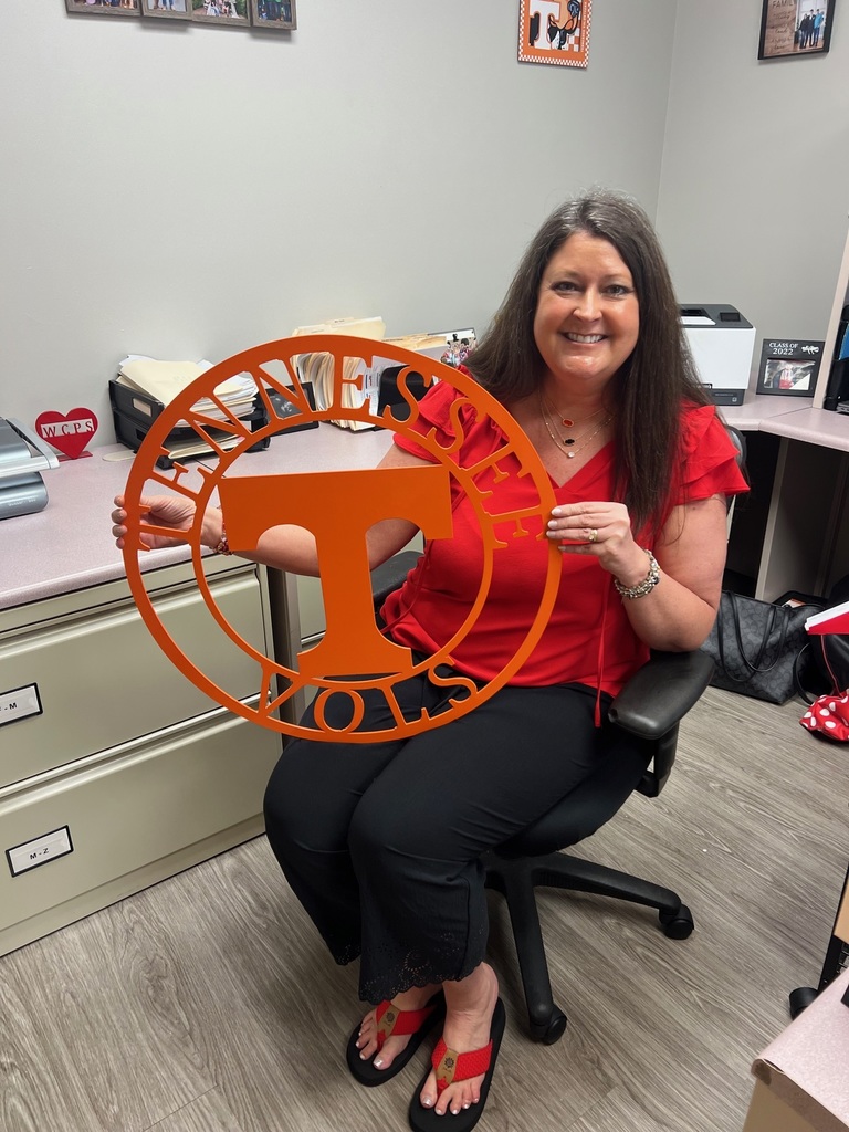 Mrs. Fultz holds a Tennessee sign