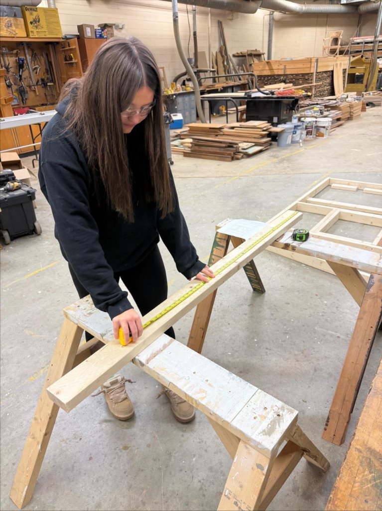 A female student measures a board