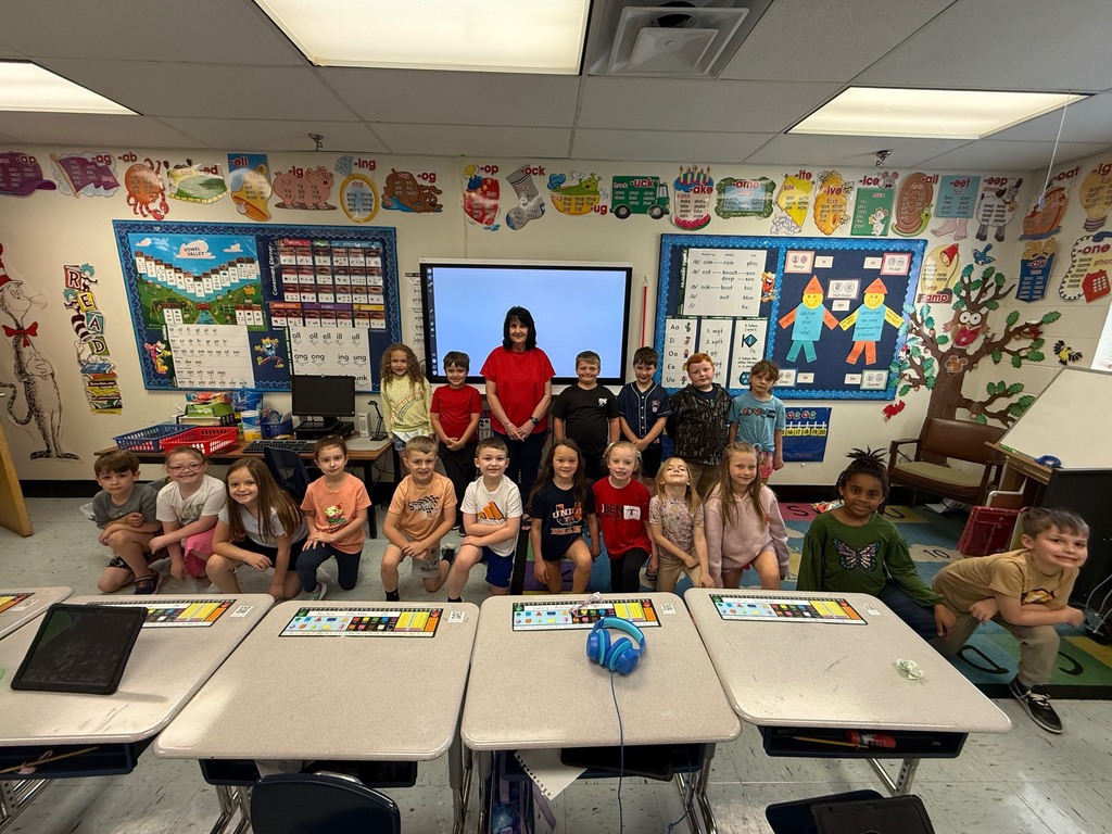 Mrs. Judy Carroll and her first grade students