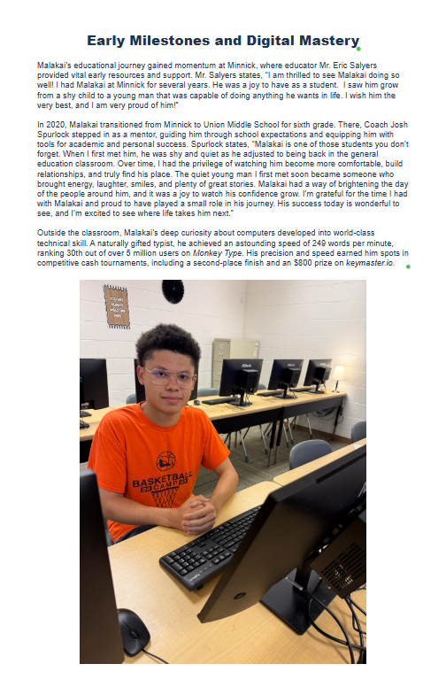 A young man in an orange t-shirt, glasses, and a headset sits at a computer, smiling, surrounded by more computers.
