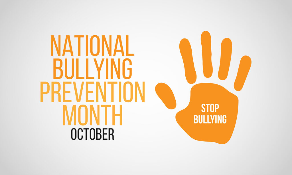 White background with "National Bullying Prevention Month, October" text and an orange handprint with "STOP BULLYING" below.