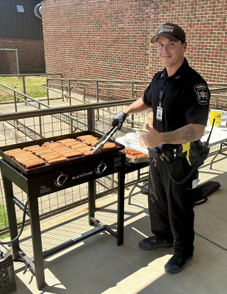 WCISD SRO Deputy Whitley conquered the heat to cook the hot dogs.