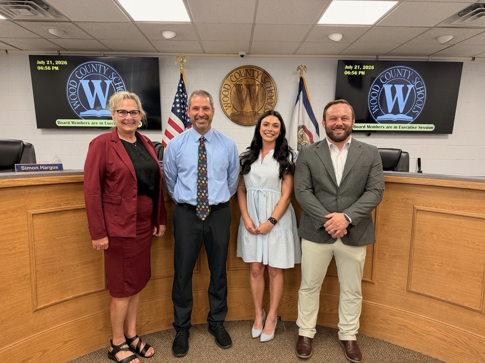 Principals standing for photo at BOE meeting