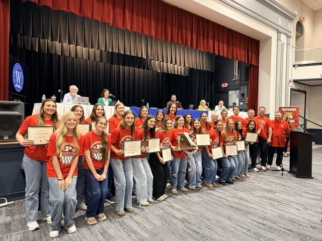 parkersburg high school student athletes accepting recognitions letters at the wood county board of education meeting