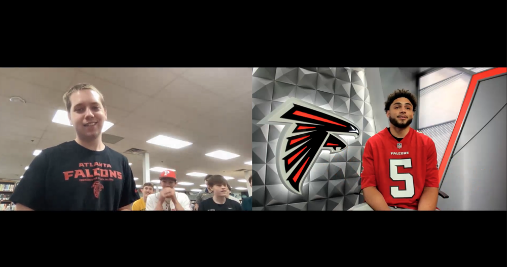 Image of football player in Zoom call with Parkersburg high school sports in American culture class presenting opportunity to a student. Students look excited and happy. Students are sitting in a high school library.