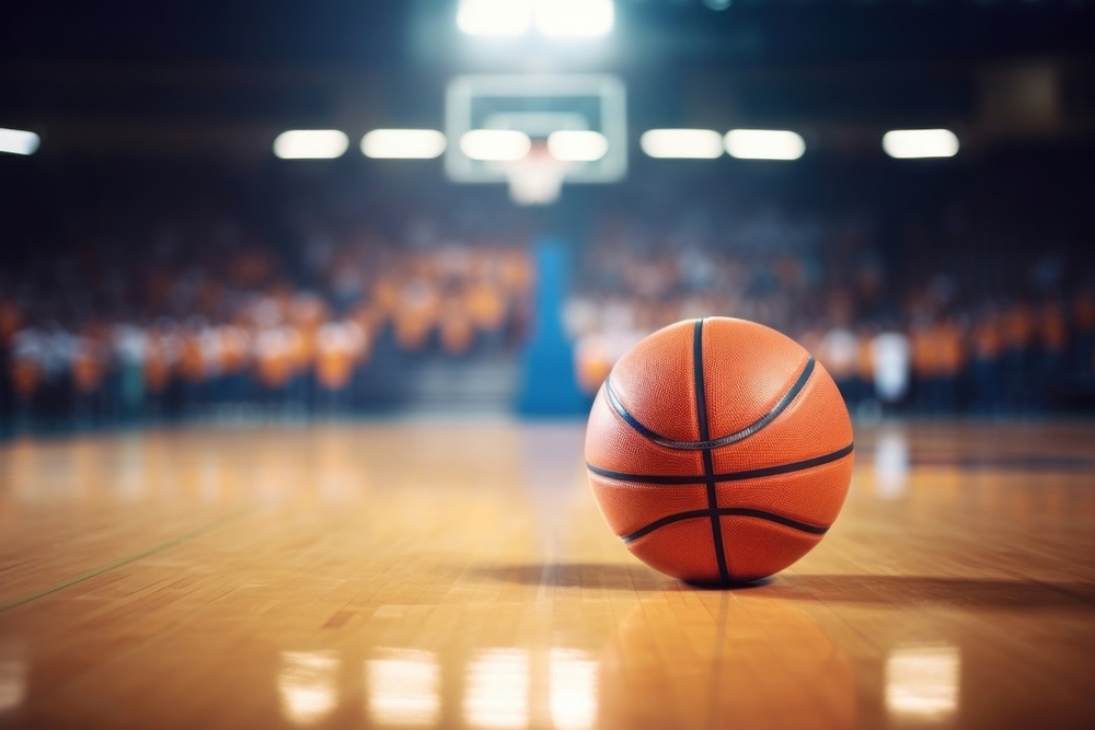 image of a single basketball on a blurred court