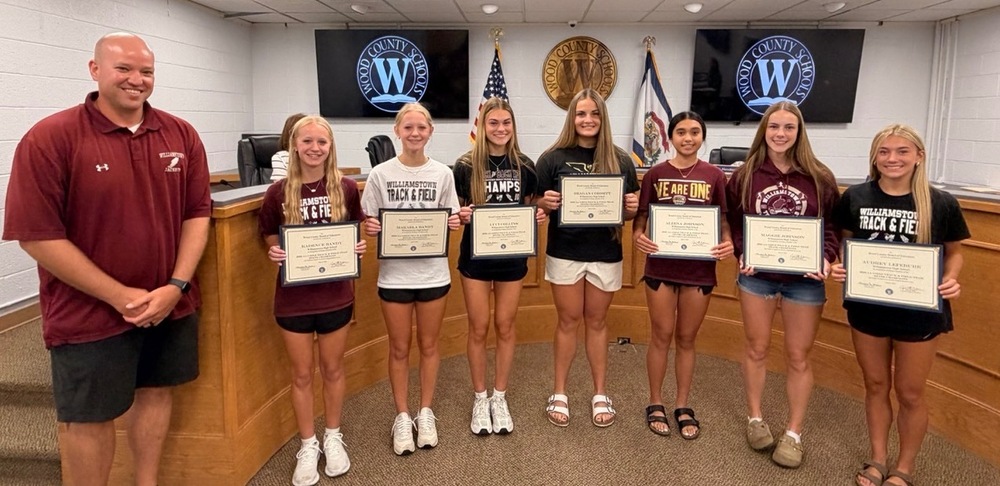 Track team with coach