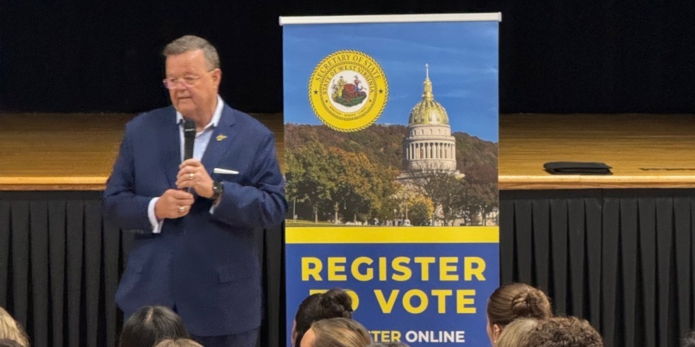 image of wv secretary warner beside a banner that says 'register to vote'