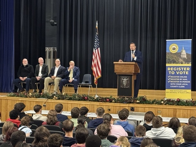WV secretary of state standing on the stage of parkersburg south high school addresses future voting students