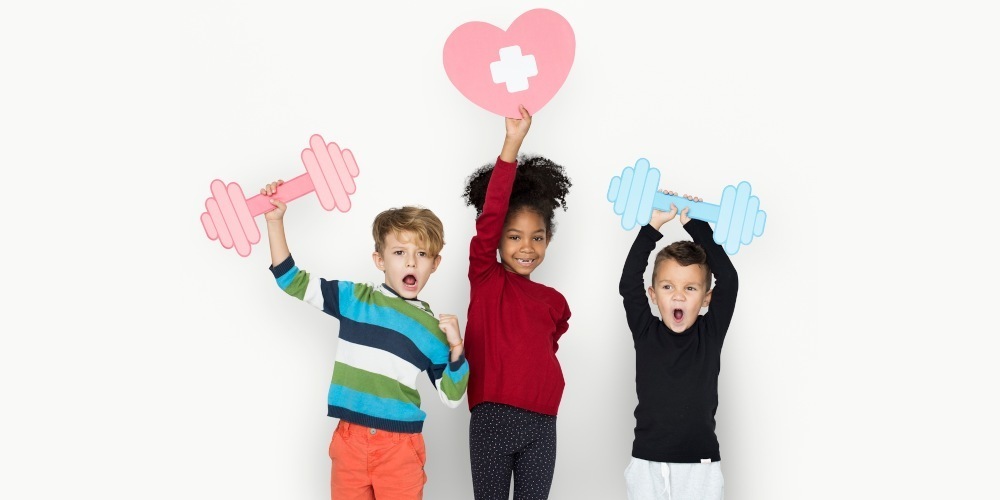 three students - two holding a virtual dumbell and one holding a virtual heart with a cross representing health