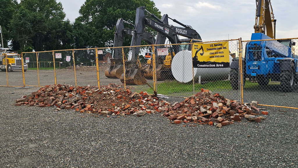 image of bricks in a parking lot from the demolition of the former Lincoln Elementary School