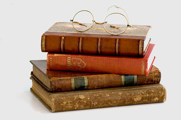 stackofbookswithglasses