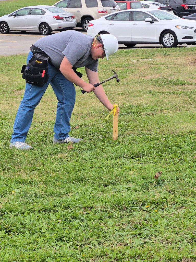 Carpentry class learning how to survey