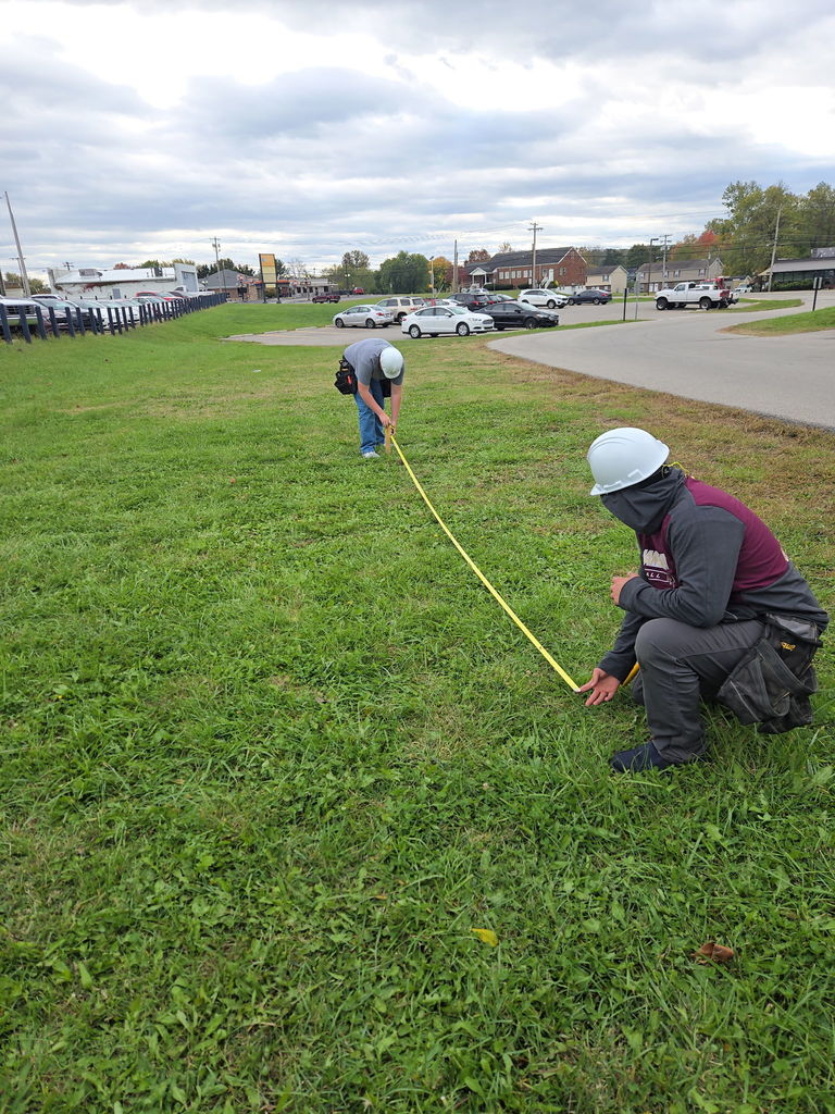 Mr. Kimble's Class learning how to survey