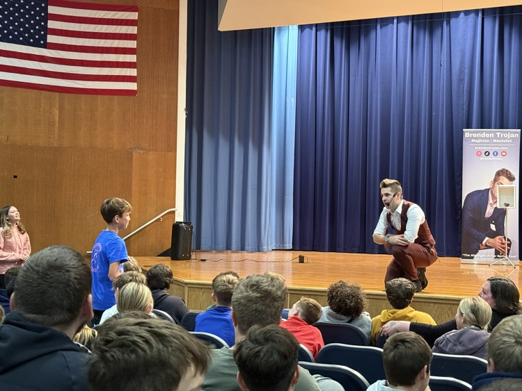 student standing in audience 