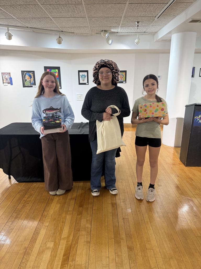 students pose with prizes. 