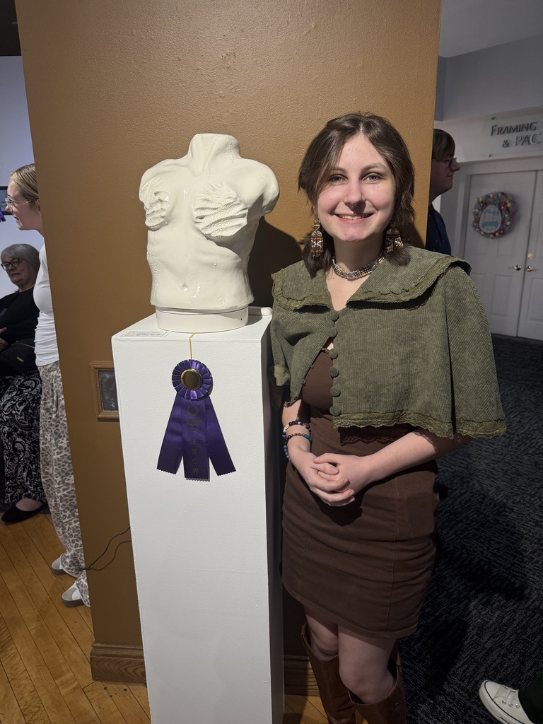 student with ceremic statue