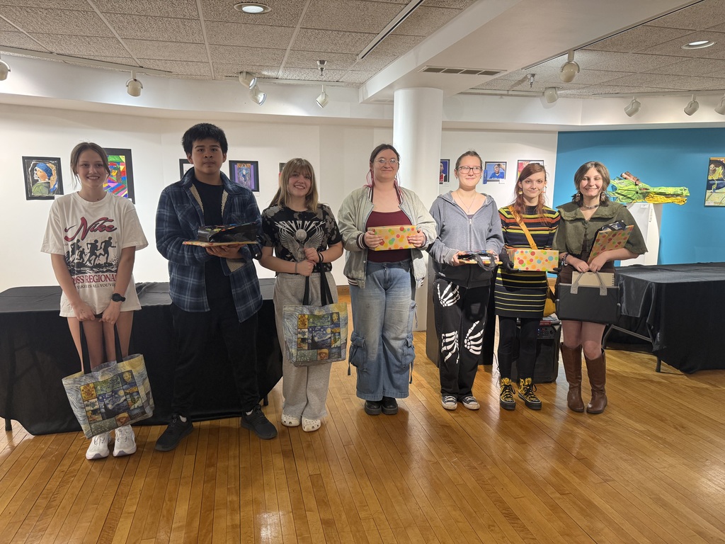 students pose with prizes